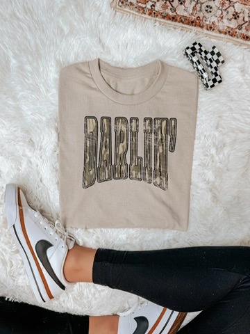 Beige Darlin' graphic T-shirt featuring large distressed western lettering.